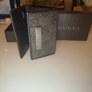 Authentic Gucci black trifold key holder wallet with the original box and COA.